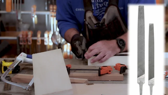 Clean up any imperfections on the cut hinge using a file.