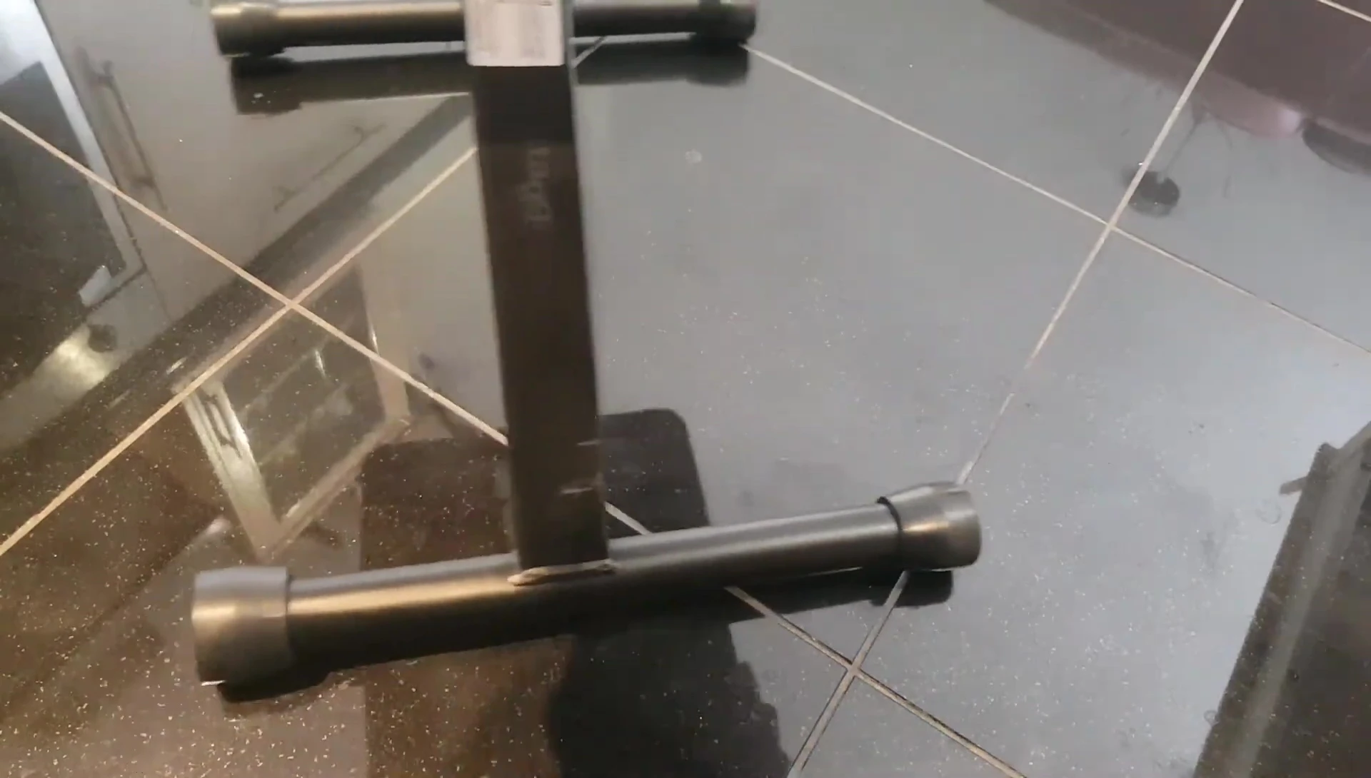 Close-up showing the adjustable foot for uneven surfaces.
