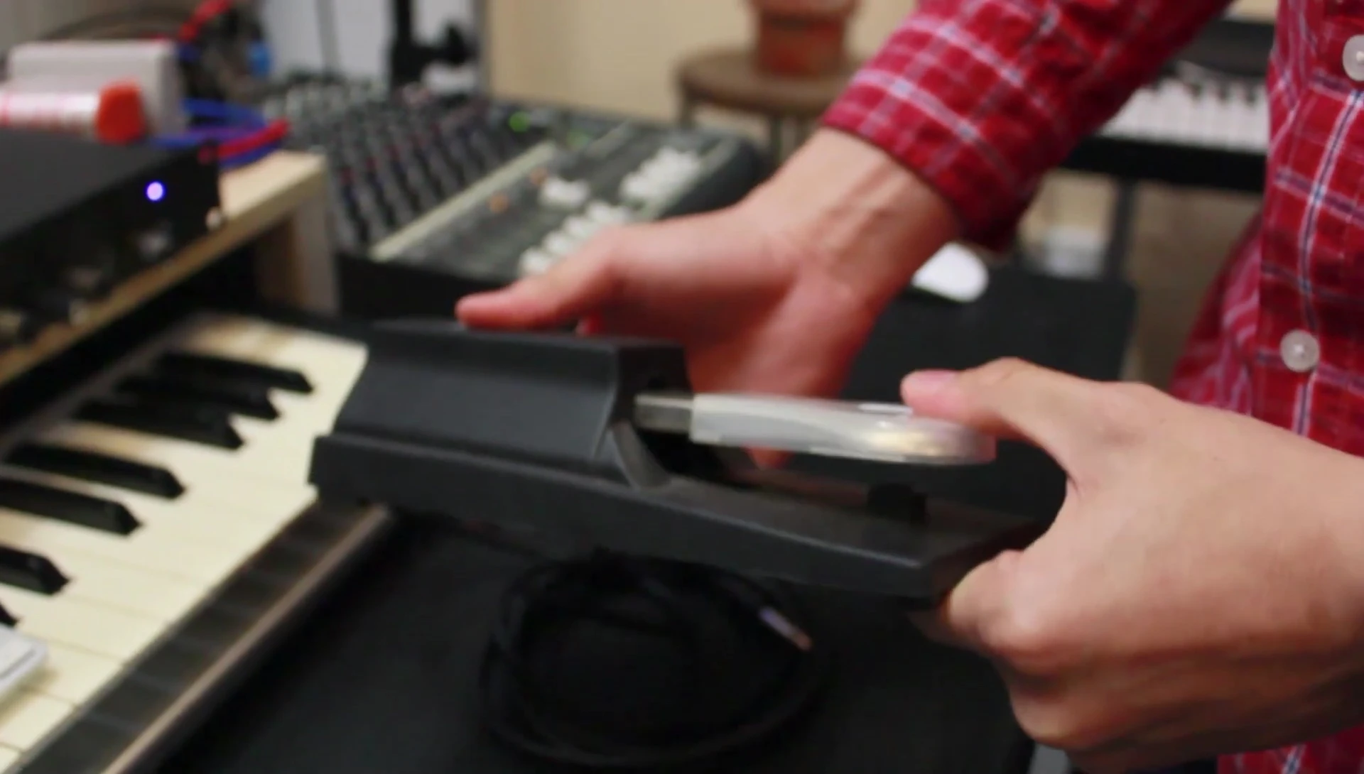 Close up of a piano-style sustain pedal