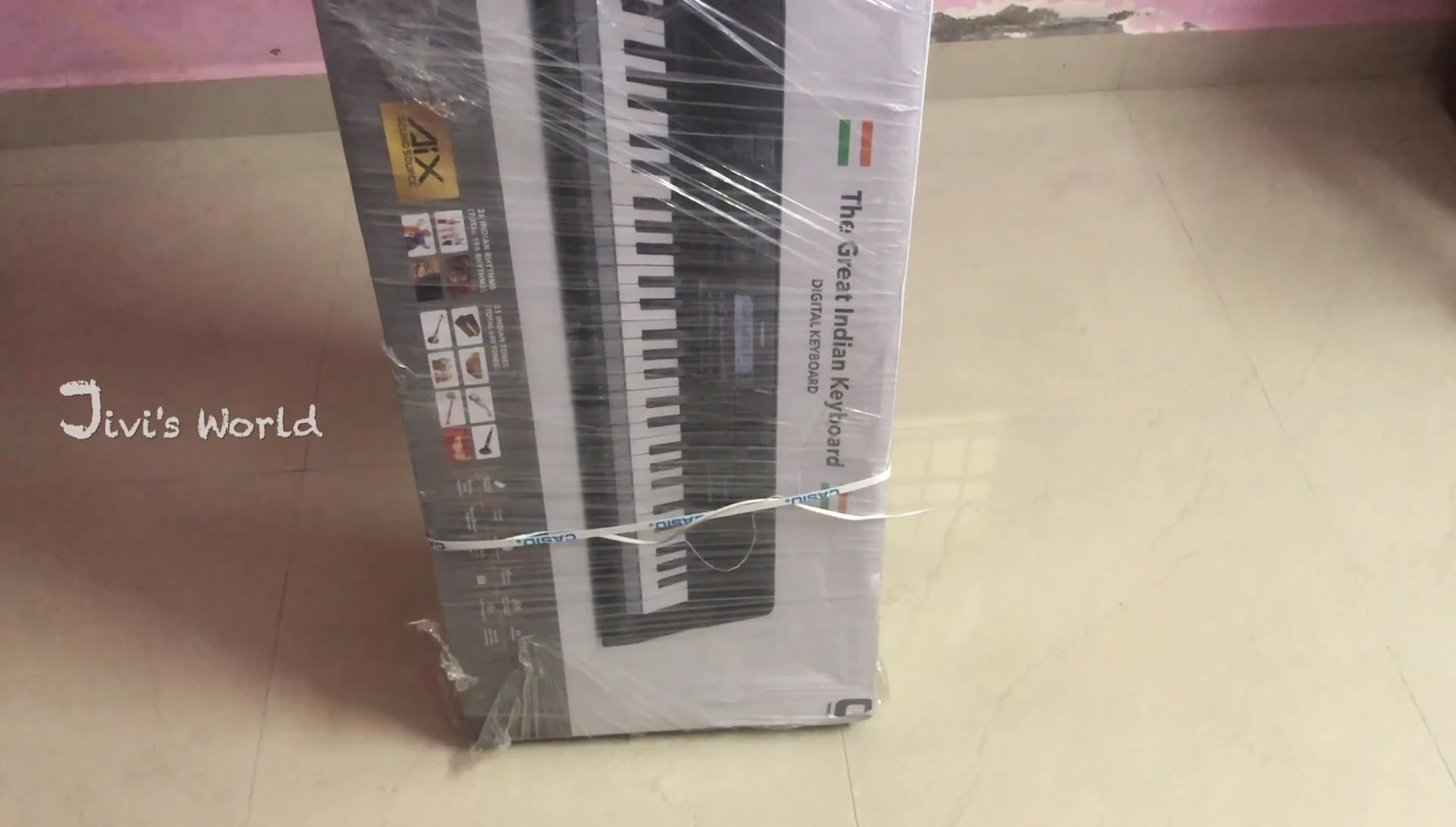 Close-up shot of the Casio keyboard box being opened.