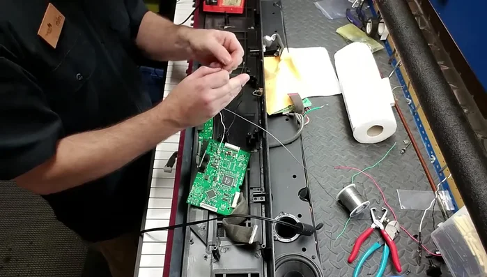 Solder the wires to the appropriate terminals of the new metal jack.