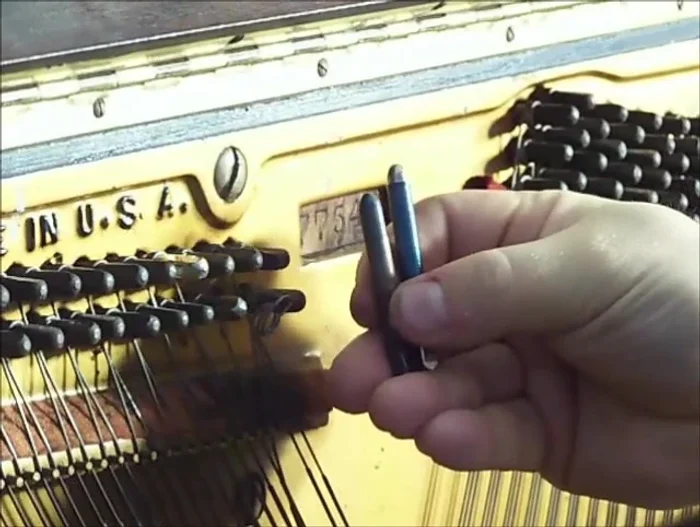 Drill a hole slightly larger than the new pin's diameter (using a 17/64 inch drill bit in this case).