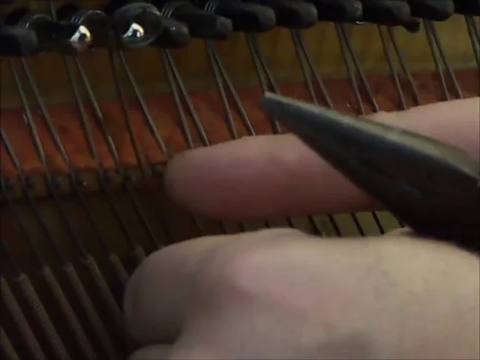 Tighten the new pin slightly (about a quarter turn), using needlenose pliers to crimp the string in place.