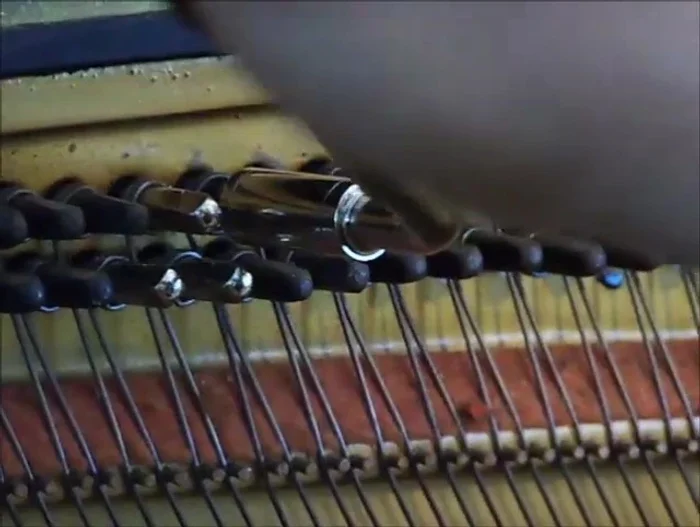 Loosen the old tuning pin using the tuning hammer. Unwind the coils about two millimeters.