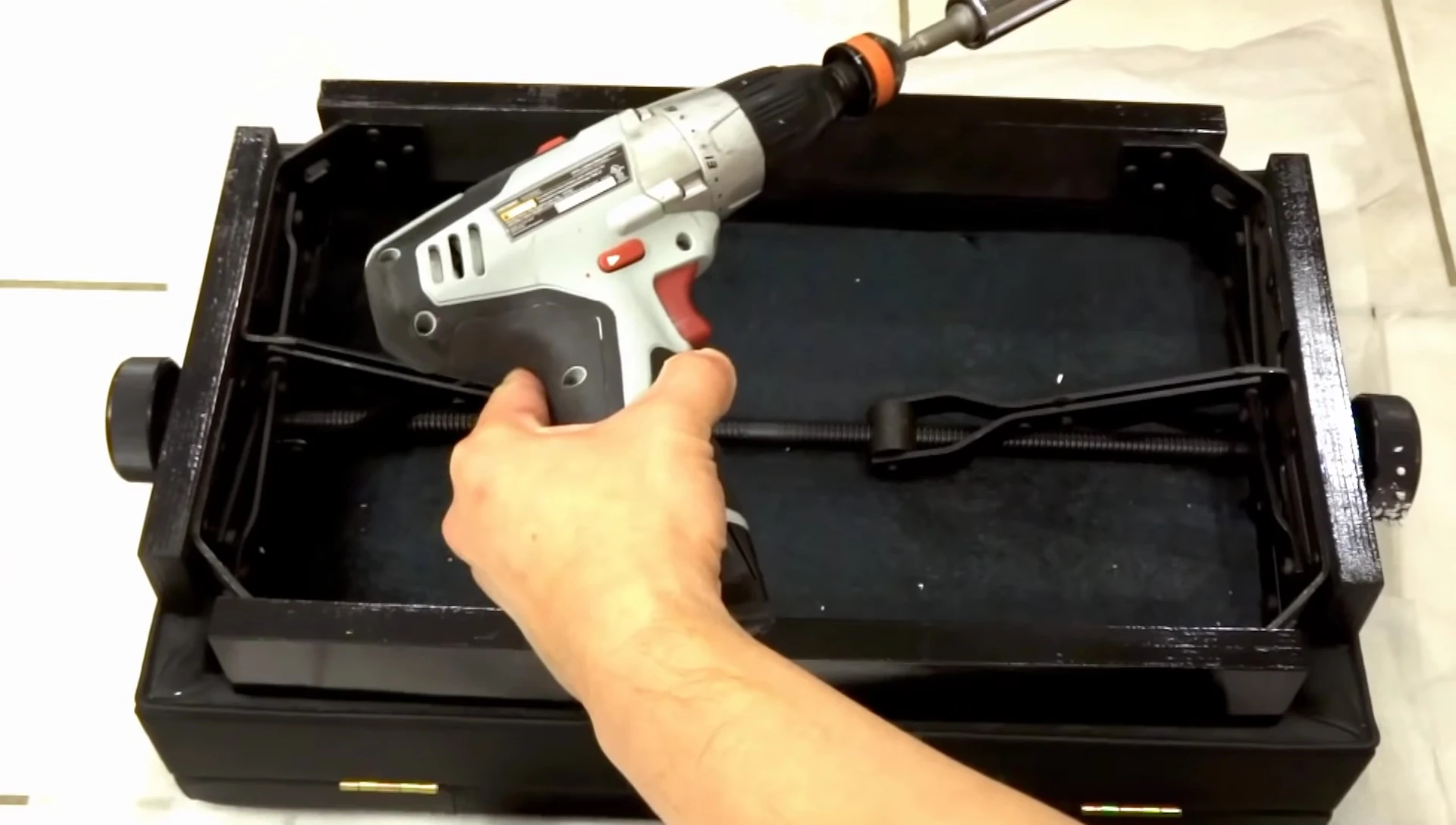 Cordless screwdriver being used for assembly