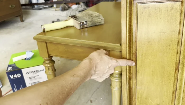 Apply a glaze (like General Finishes Glaze Effects in Van Dyke Brown) to add depth and brown lines. Use a brush, then a deck brush to smooth and blend. Wipe back excess on edges.