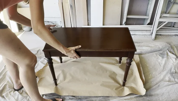 Strip the old stain using Smart Strip stripper. Apply with a chip brush, let it sit, and scrape off.