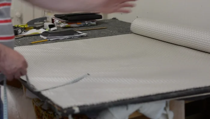 Mark the center of the fabric (front and back). Notch the front and, using a defined stripe as a guide, find the matching point on the back and notch it. Avoid relying on just folding and notching both ends simultaneously, as stripes may not perfectly align.