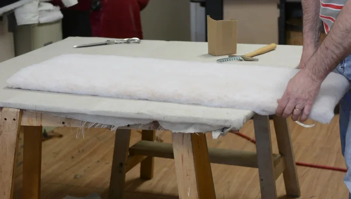 Mark the center of the fabric (front and back). Notch the front and, using a defined stripe as a guide, find the matching point on the back and notch it. Avoid relying on just folding and notching both ends simultaneously, as stripes may not perfectly align.