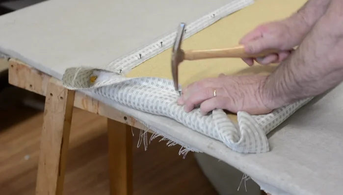 Add pin tacks to the sides at the center points, ensuring straight stripes.