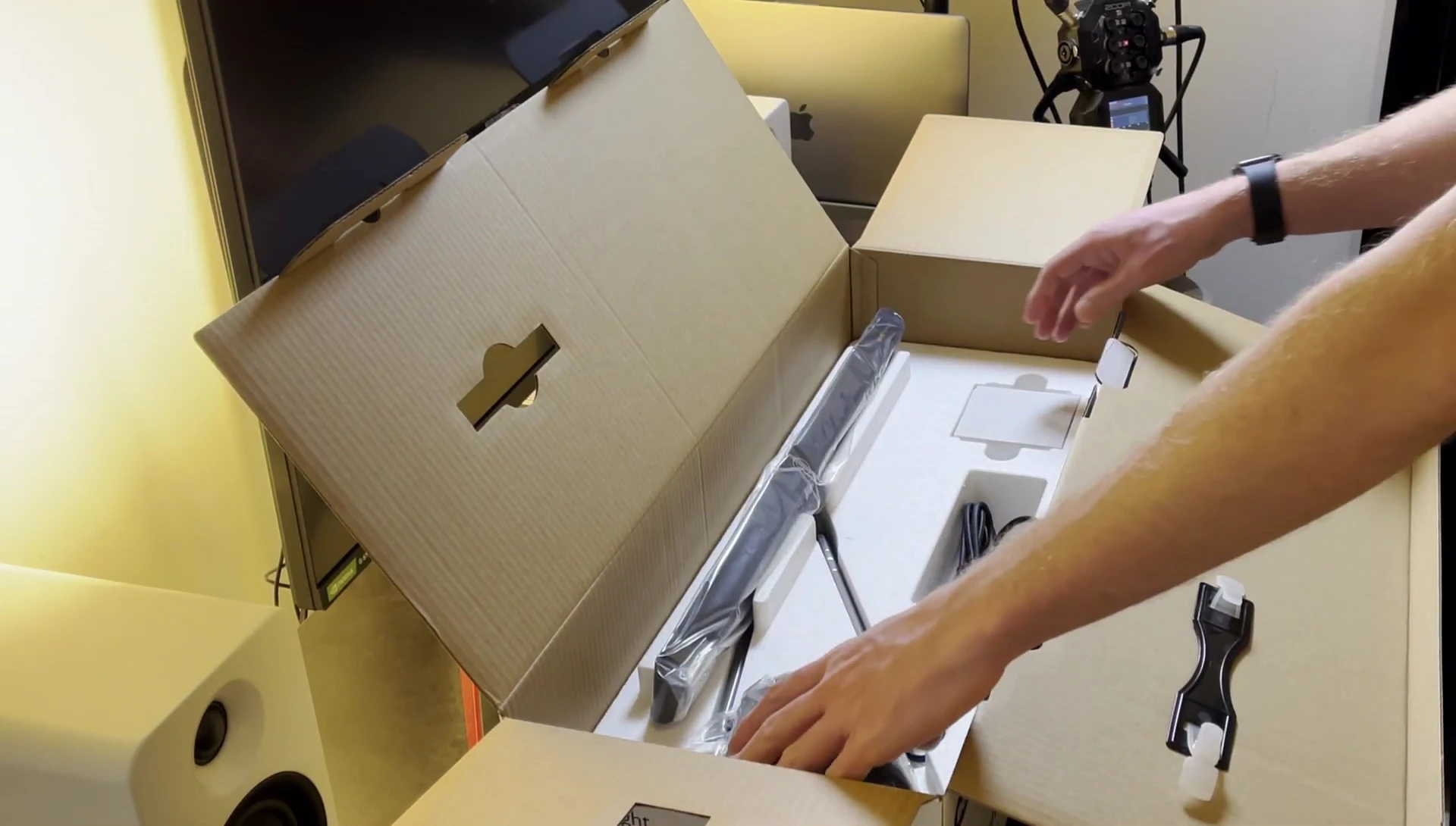 Close-up of the BenQ Piano Light after unboxing, showing its compact size.