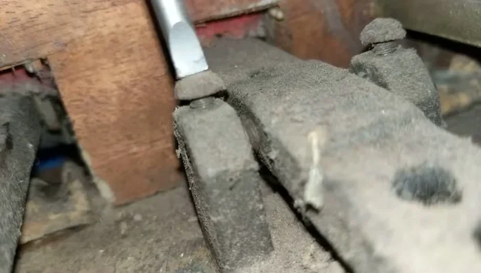 Re-tighten the top screw about half a turn.