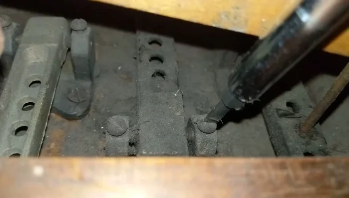 Re-tighten the top screw about half a turn.