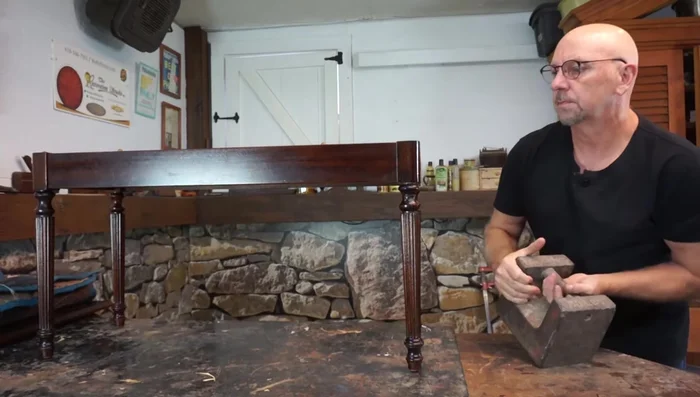 Apply weight (50 pounds) to the repair overnight to hold it in place while the glue dries. Avoid using clamps, as they may distort the leg.