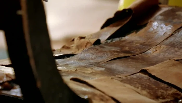 Strip the bench: remove old leather, padding, and calico.