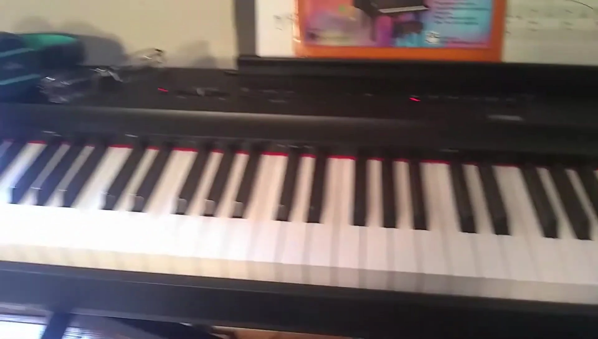 Image showing the compact size of the Yamaha P125 compared to a larger keyboard.