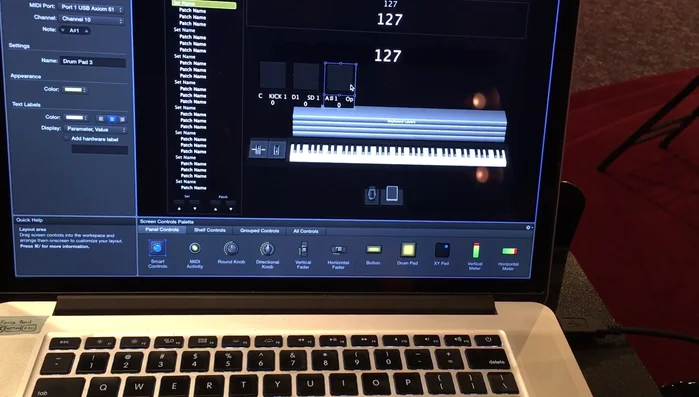 Assign each button to trigger its corresponding Playback instance. This will play the backing track/loop for that song.
