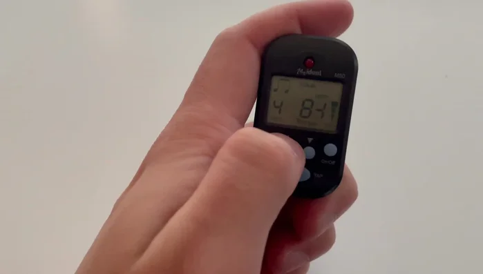 Adjust the tempo using the up/down buttons. You can do this while the metronome is playing.