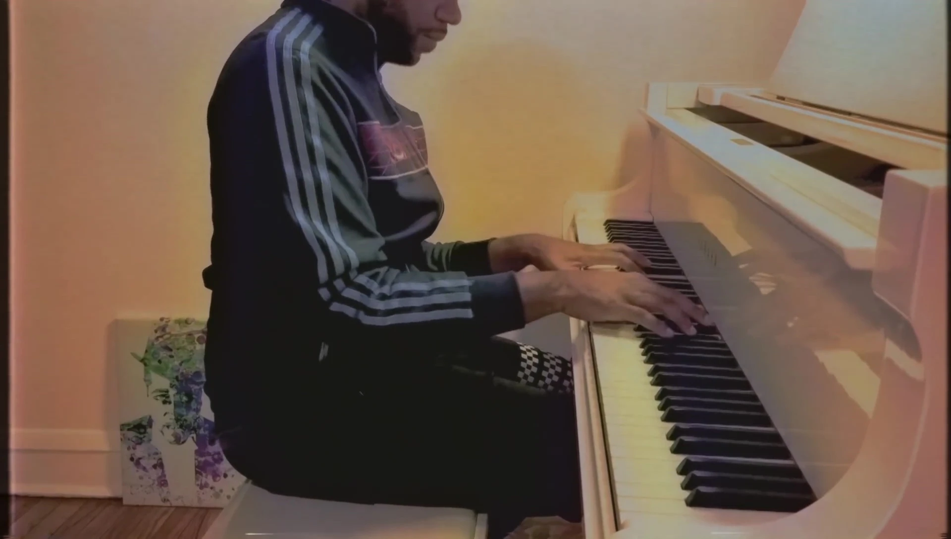 A mid-performance shot focusing on the expressions on the pianist's face.