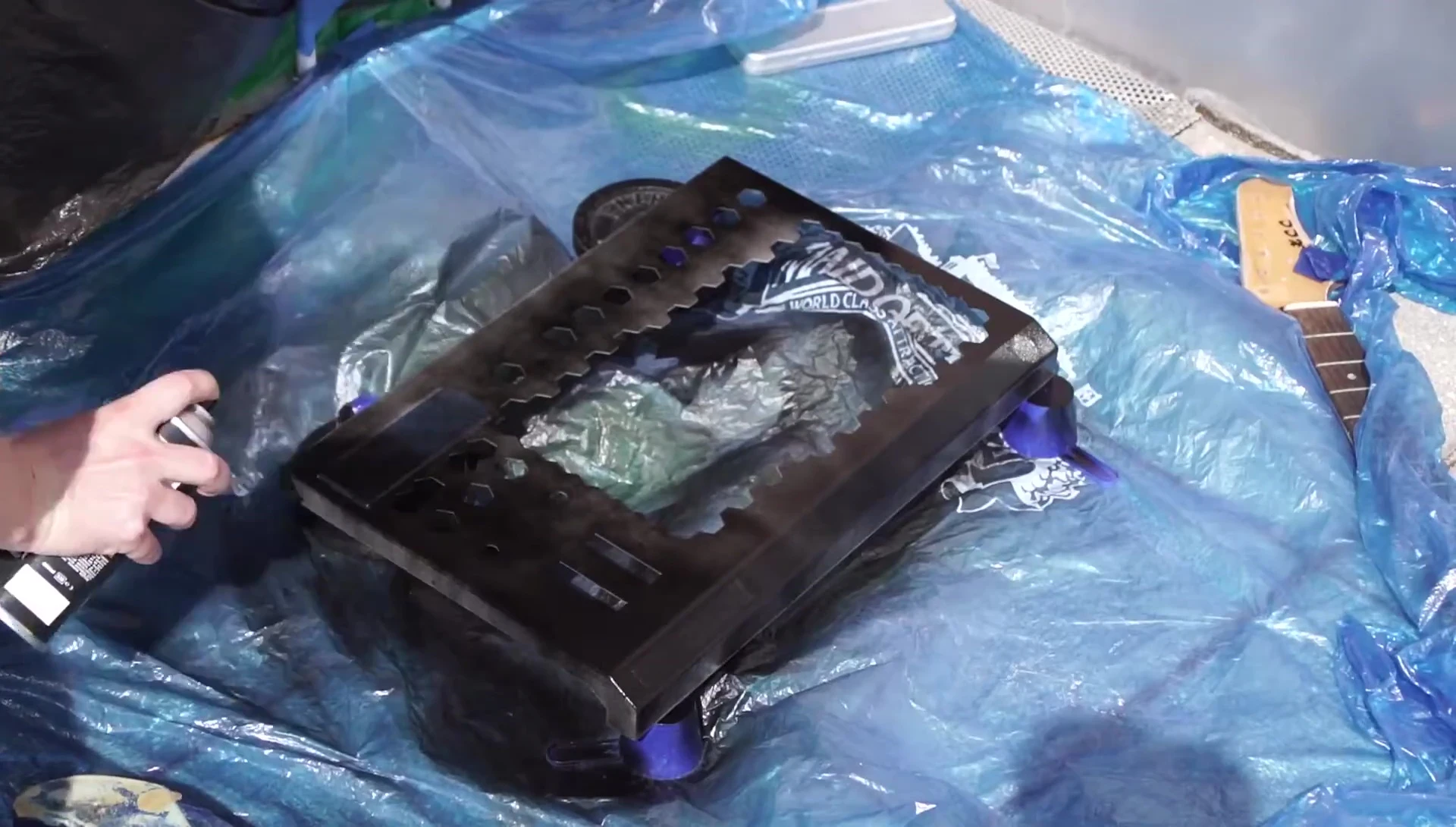Applying the black base coat to the keyboard.