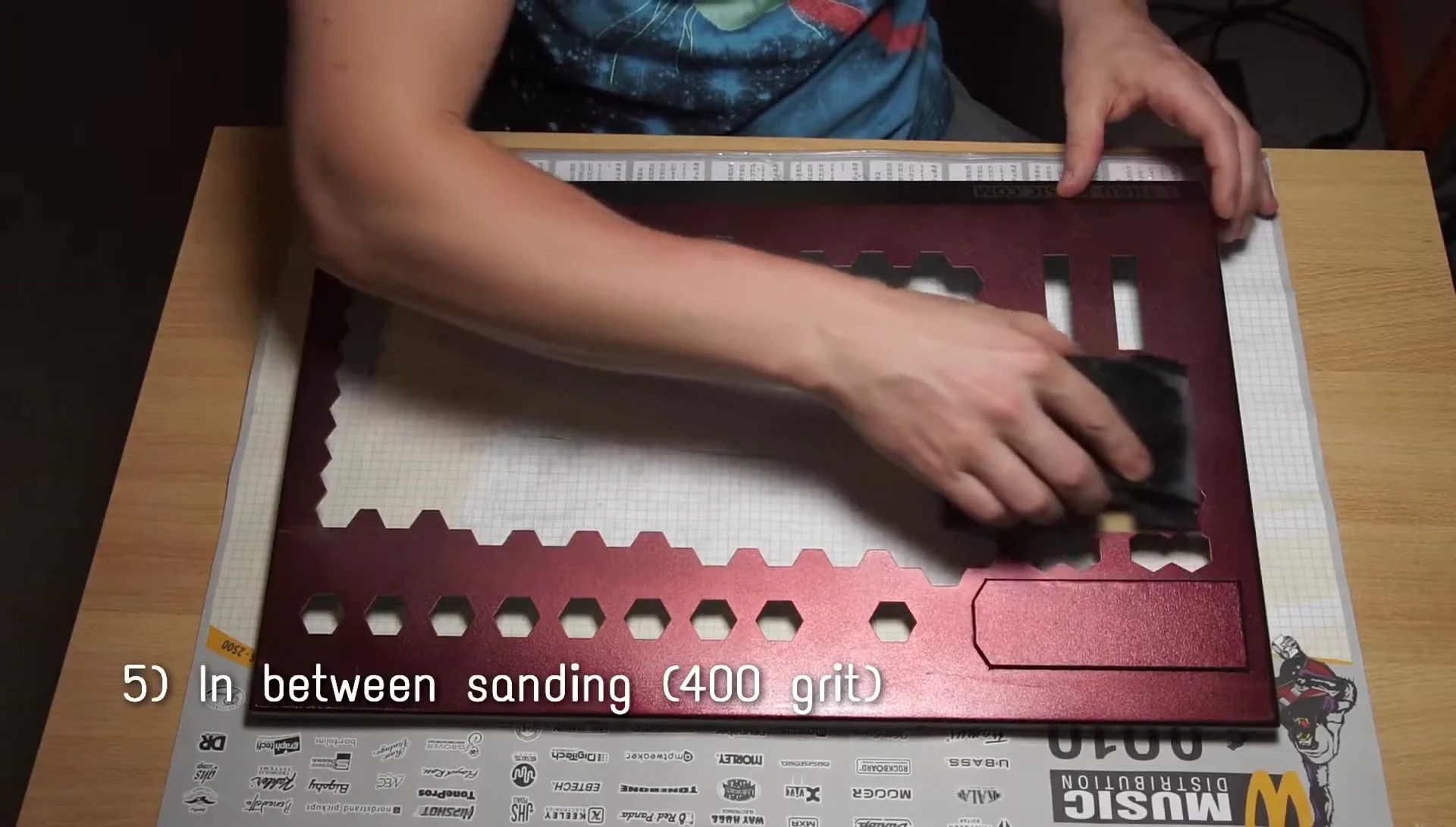 Sanding the painted keyboard.