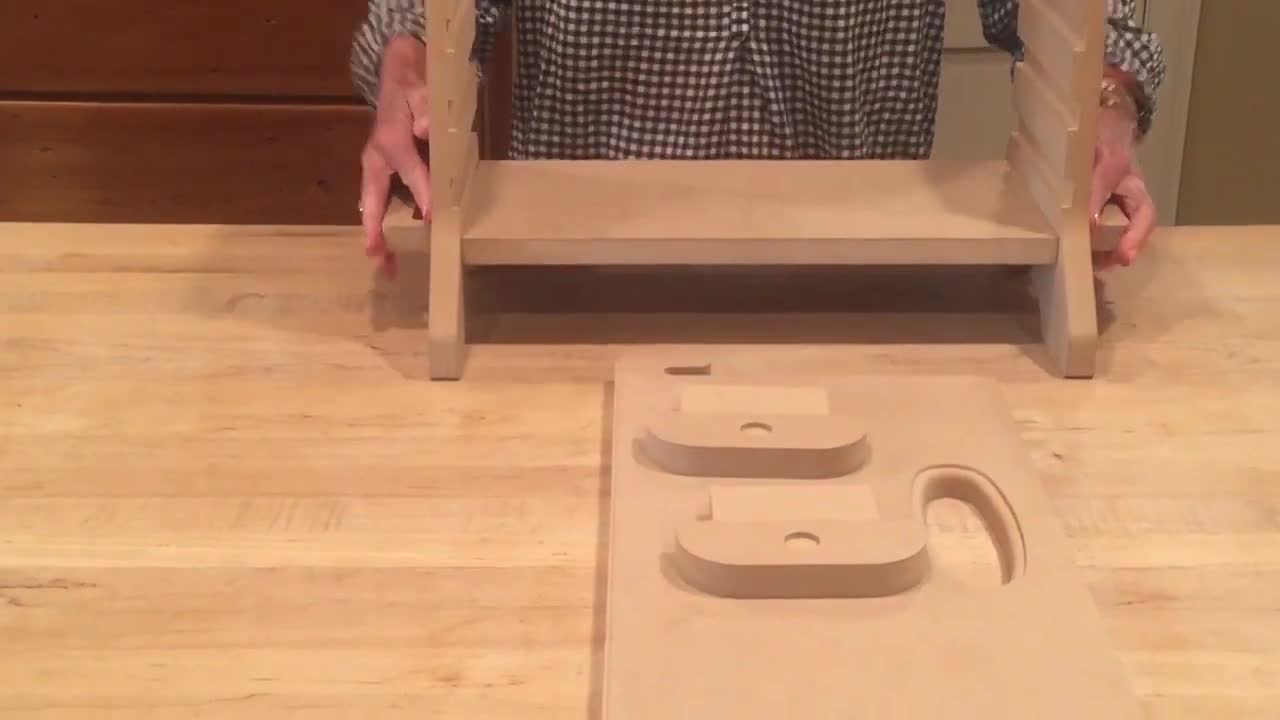 A child using the footrest, showing the adjustable height feature.