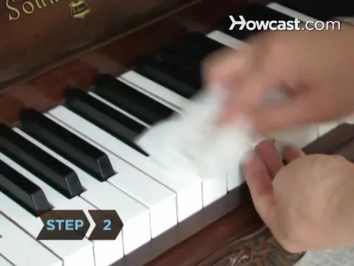 Clean plastic keys with a lint-free cloth dampened in a vinegar and warm water solution. Avoid dripping liquid down the sides of the keys.