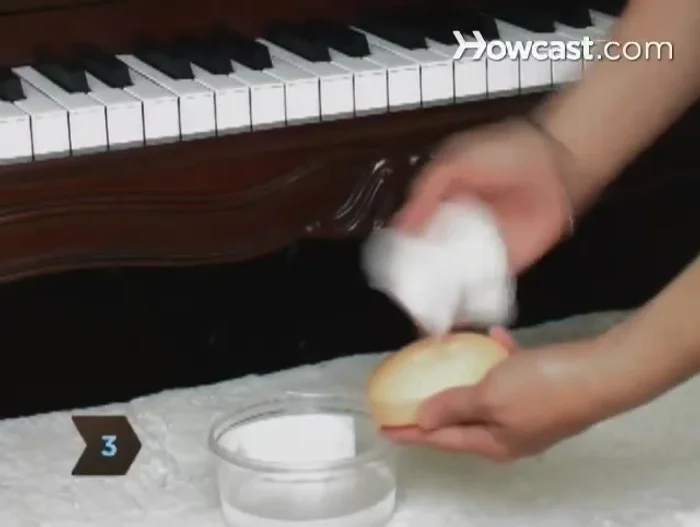 Clean ivory keys with a damp cloth and gentle soap. White toothpaste can also be used.