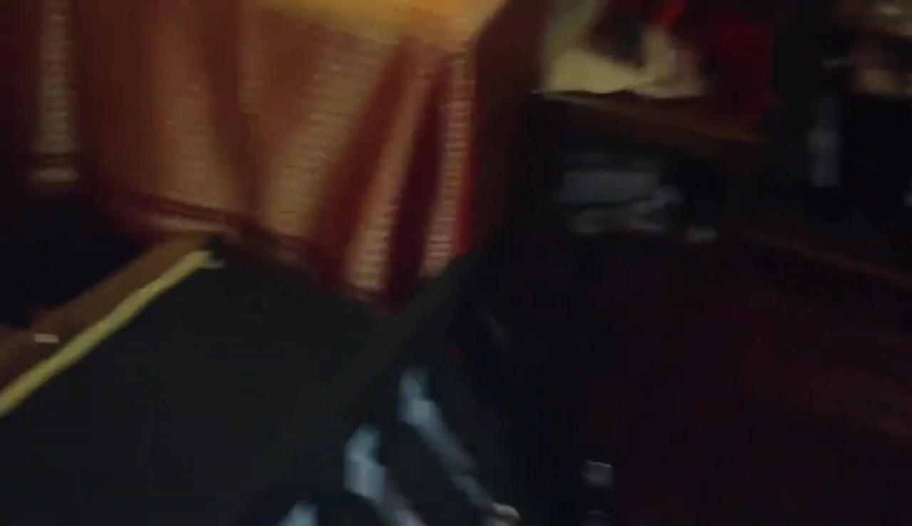 The smaller portion of the chair being carried up the stairs