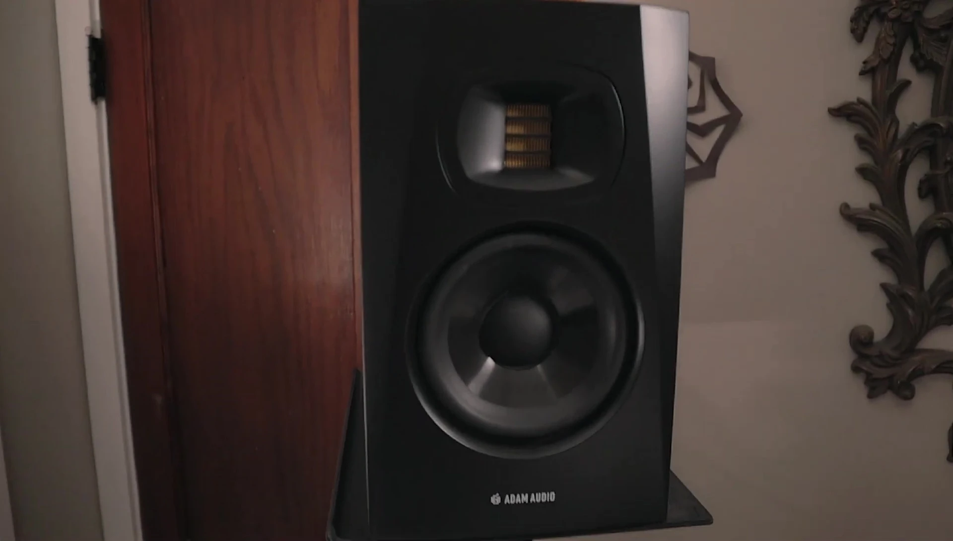 Atom T5V studio monitors mounted on stands