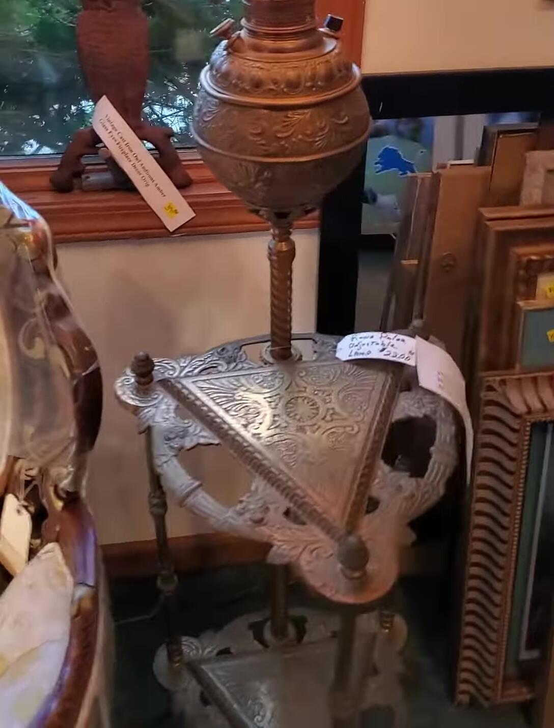 Close-up of the Bradley & Hubbard maker's mark on the lamp