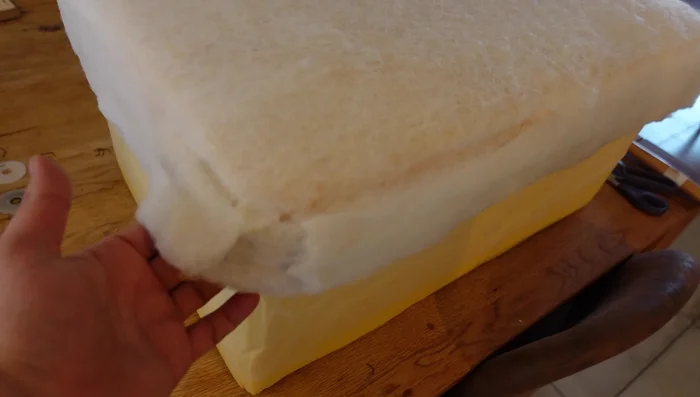 Trim the excess foam padding to achieve a flat top surface.