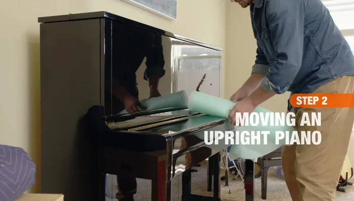 Protect the piano: Wrap the pedals and keys with bubble wrap and tape. Wrap the lid over the keyboard and secure it with tape. Wrap the entire piano with moving blankets and secure with tape.