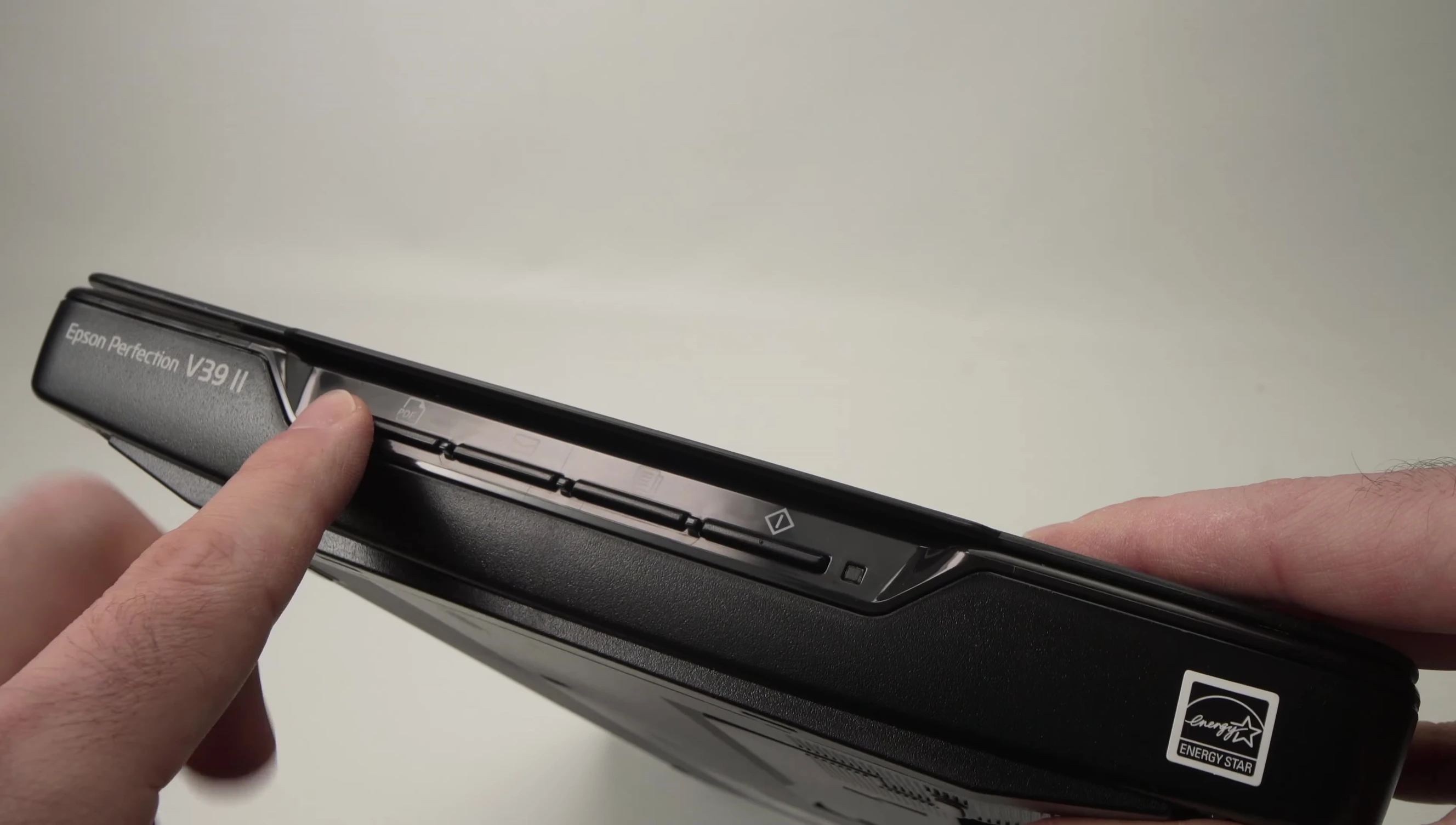 Close-up of the front panel buttons on the Epson Perfection V392 scanner.