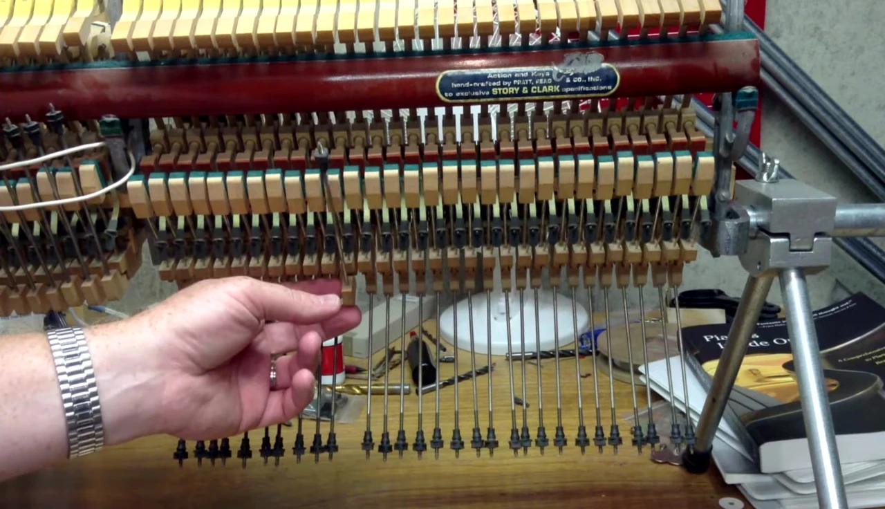 Close-up of wooden elbows attached to the lifter wires.