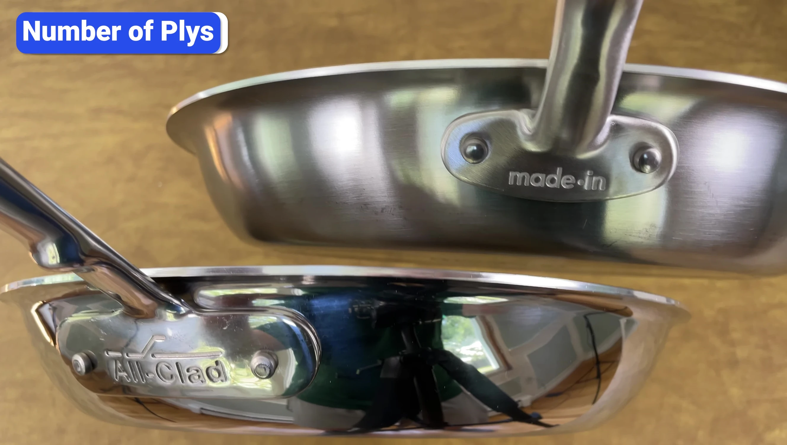 Comparison of All-Clad D3 and Made In pans highlighting the similar composition despite different ply claims.