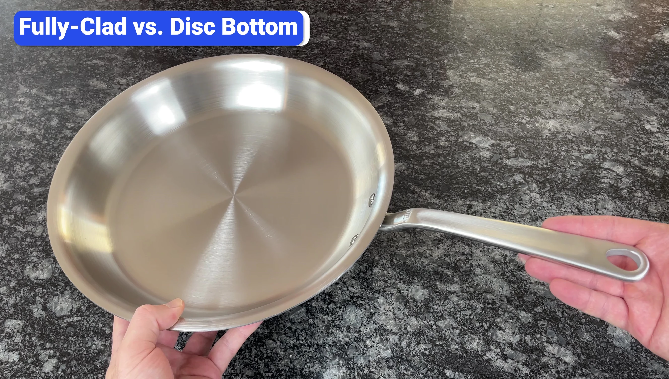 Cross-section of a fully clad stainless steel pan showing the layers of steel and aluminum.