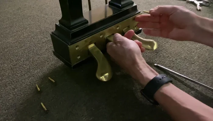 Lift the pedal plate off. Note: The screws are aligned when the plate is at the top.