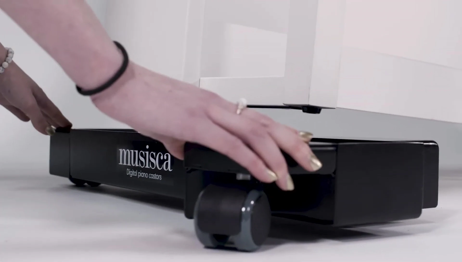 A person demonstrating how easy it is to attach the castors