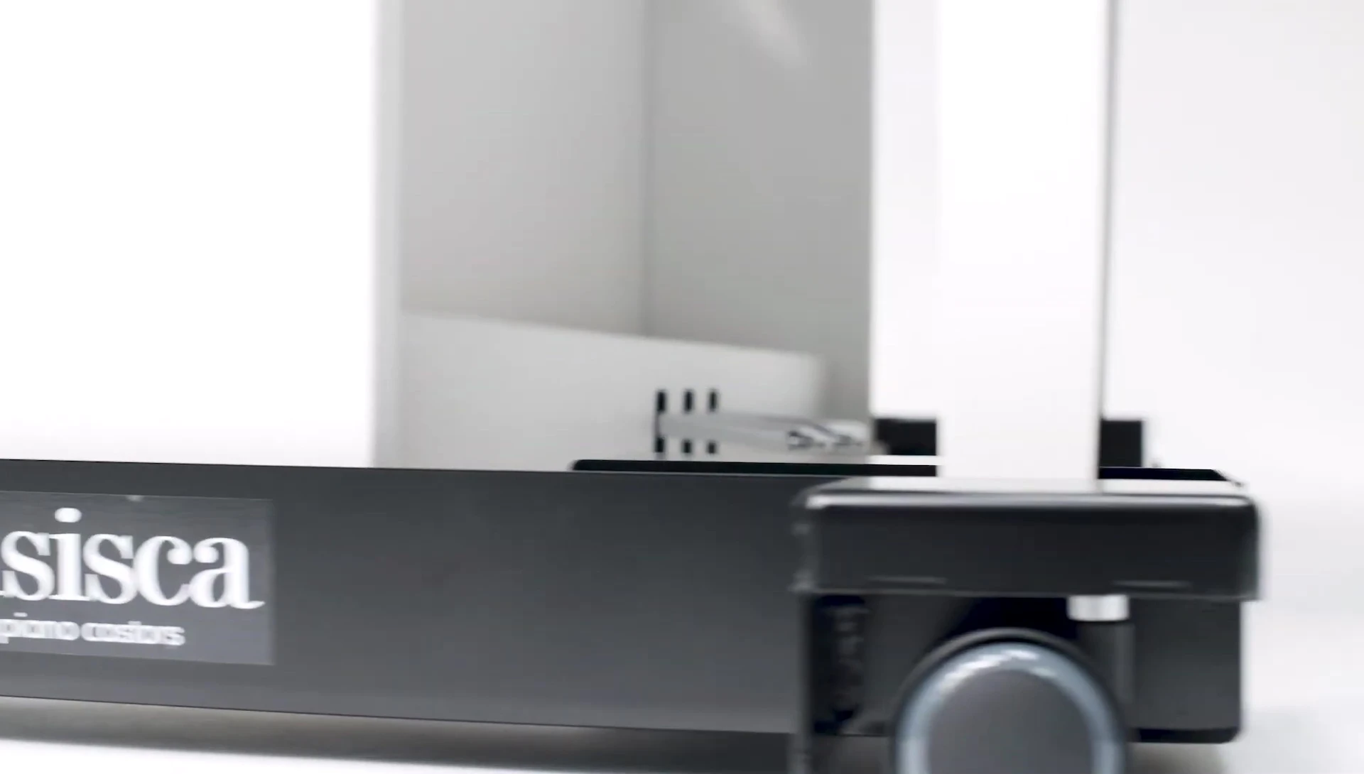 The caster glides under a piano, highlighting stability