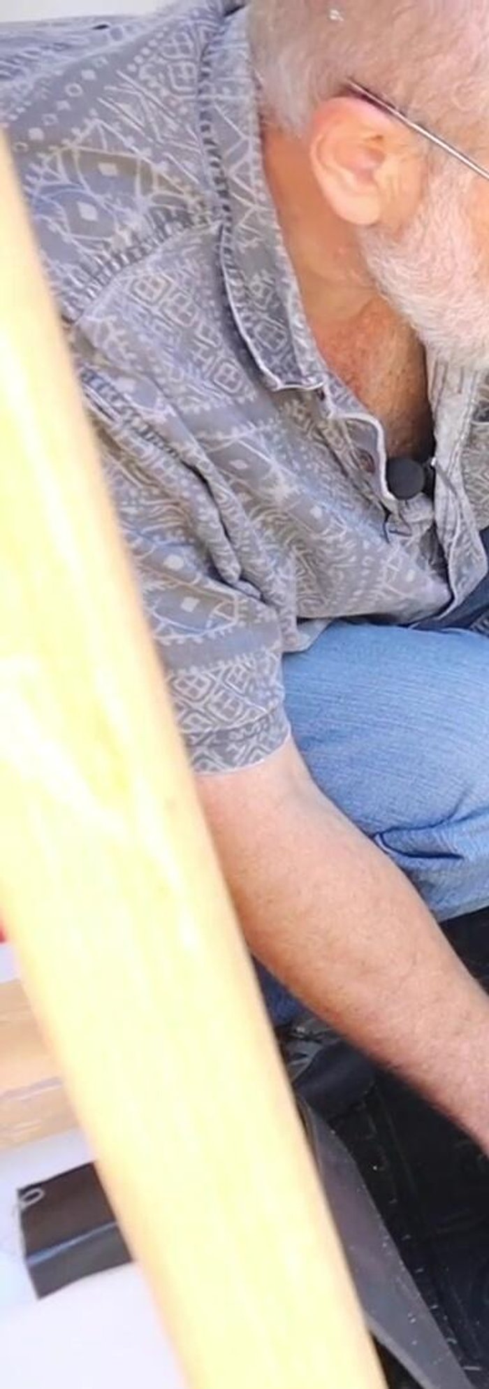 Secure the center support where the piano hinge is located to enhance the footrest's sturdiness.