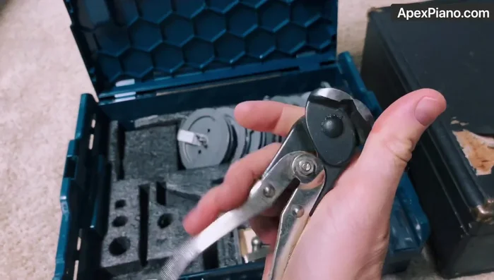 Use needlenose pliers to manipulate strings and coils as needed.