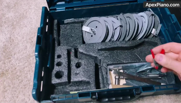 Use the string lifter to carefully lift and guide the strings into position.