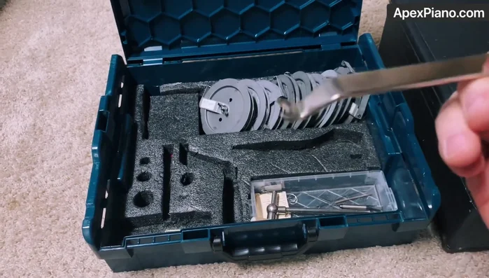 Use the string lifter to carefully lift and guide the strings into position.