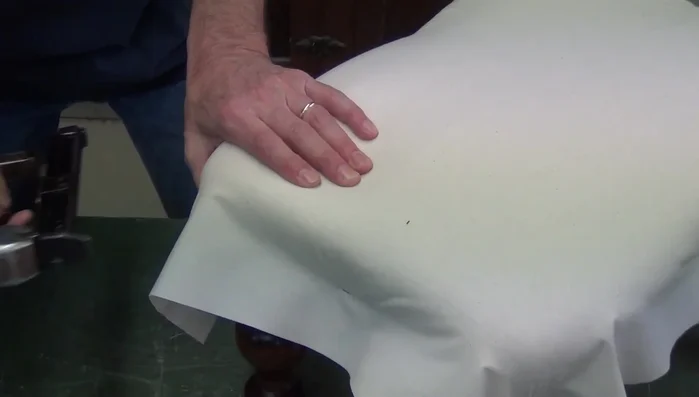 Shaping the upholstery profile using fingertips and palm