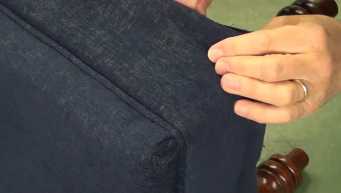 Making a diagonal cut towards the leg, stopping short of the frame