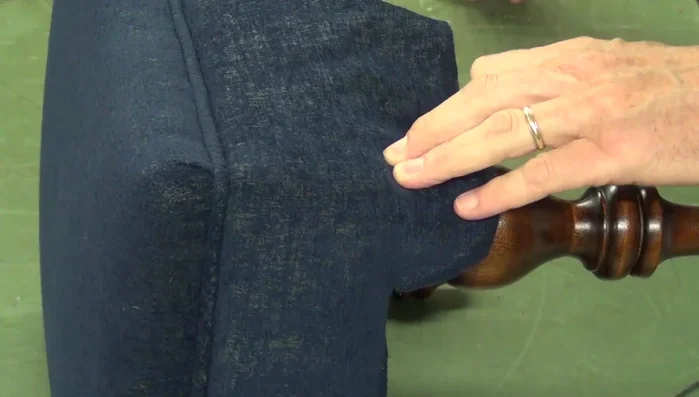 Making a diagonal cut towards the leg, stopping short of the frame