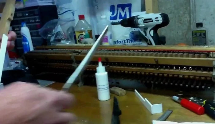 File the excess key top material until flush with the wood, being careful not to scratch the key top.