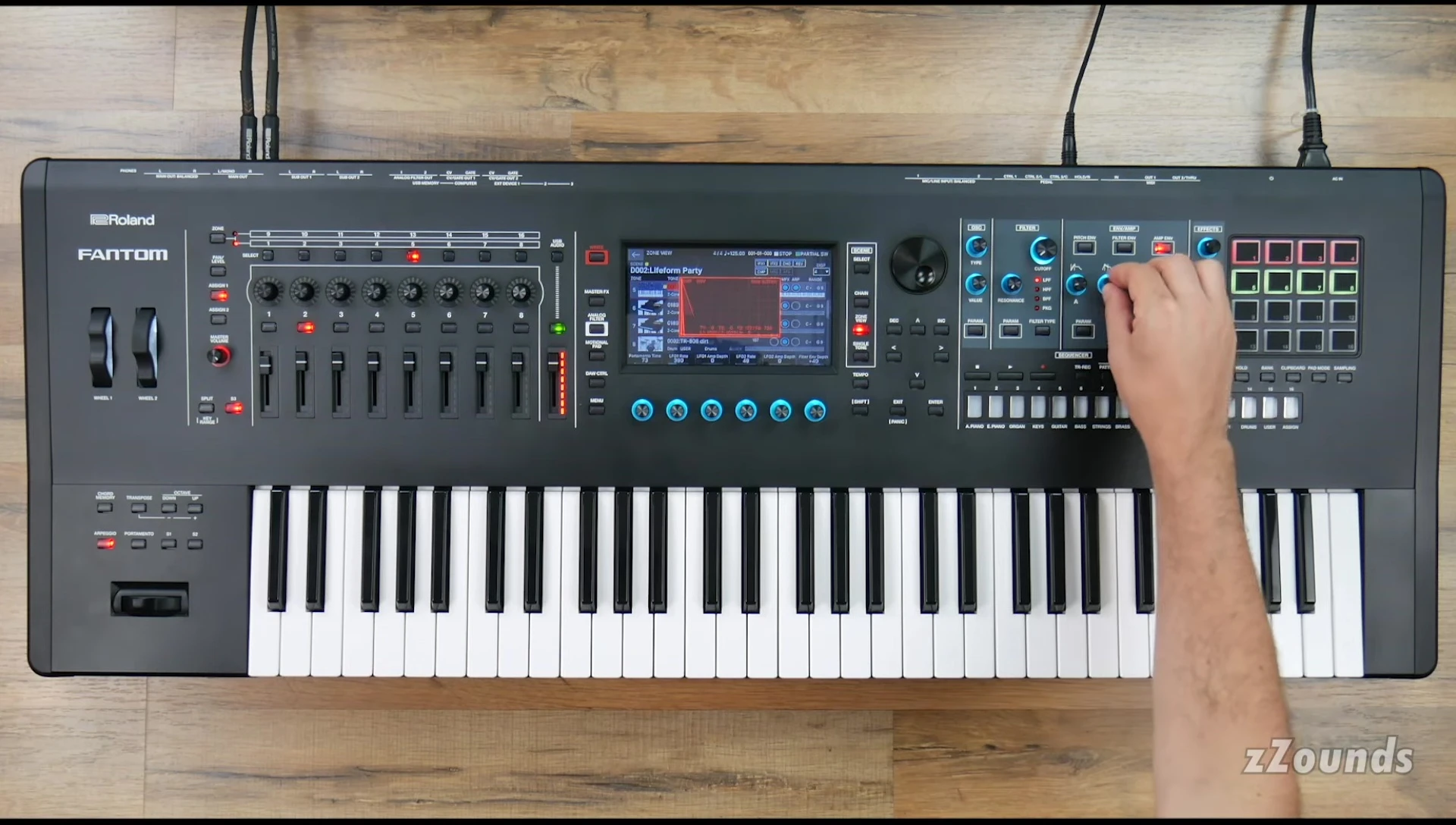 A view focusing on the right-hand side of the keyboard and screen showing sound design and customization capabilities.