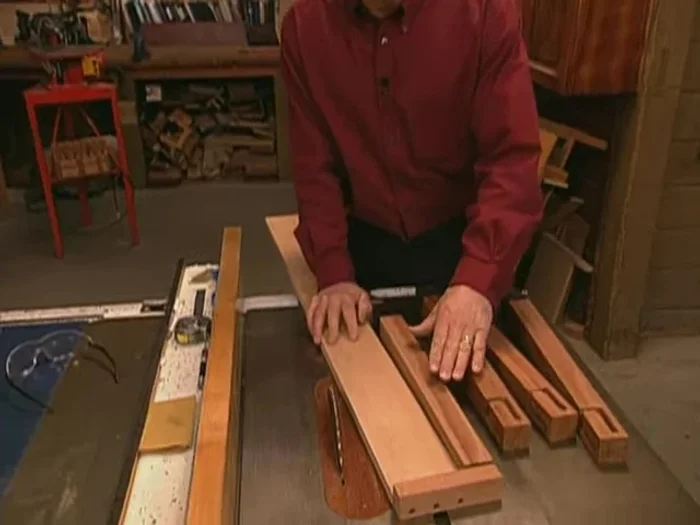 Taper legs: Using a jig at the table saw, cut tapers on the inside edges of the legs.
